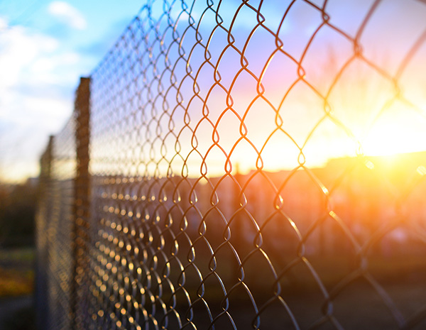 What are the reasons for the corrosion of the chain link fence ?