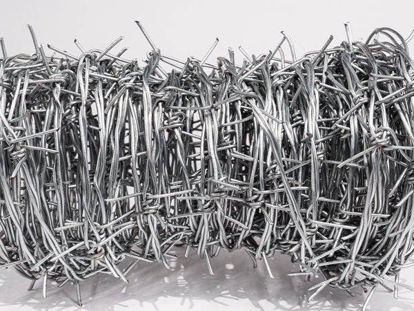 How to use barbed wire and wire mesh together