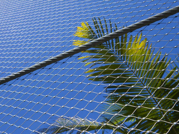 How critical is the use of safety nets or catch platforms in high-altitude construction?